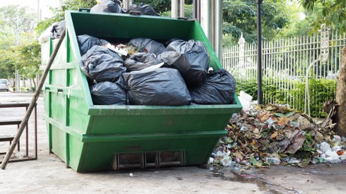 Construction workers implementing waste management strategies